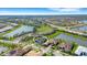 Aerial view of community surrounded by lakes and mature trees at 8901 Artisan Way, Sarasota, FL 34240