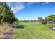 Expansive backyard with lush lawn, and tranquil water views at 8901 Artisan Way, Sarasota, FL 34240