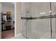 Glass shower in bathroom with double vanity sinks and walk-in closet at 8901 Artisan Way, Sarasota, FL 34240