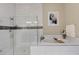 Bathroom featuring a soaking tub, glass shower with tile accents and natural lighting at 8901 Artisan Way, Sarasota, FL 34240