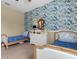 Cozy bedroom featuring two twin beds and a white dresser at 8901 Artisan Way, Sarasota, FL 34240