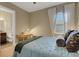 Cozy bedroom with ensuite bath featuring comfortable decor and ample natural light at 8901 Artisan Way, Sarasota, FL 34240