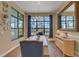 Dining room showcasing natural light with a decorative mirror accent and elegant decor at 8901 Artisan Way, Sarasota, FL 34240