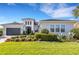 Charming single-story home with manicured lawn, mature landscaping, and a two-car garage at 8901 Artisan Way, Sarasota, FL 34240