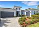 Charming home with a two-car garage and attractive landscaping at 8901 Artisan Way, Sarasota, FL 34240
