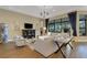 Well-decorated living area featuring hardwood floors, elegant furnishings, and natural light at 8901 Artisan Way, Sarasota, FL 34240