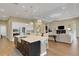Spacious living area with large island, stainless appliances, and great flow for entertaining at 8901 Artisan Way, Sarasota, FL 34240