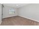 Bright bedroom with a ceiling fan, carpet flooring, and a window with shutter-style blinds at 9415 Discovery Ter # 101A, Bradenton, FL 34212