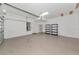 Bright garage with storage shelves and a white wall with interior door at 9415 Discovery Ter # 101A, Bradenton, FL 34212