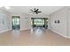 Spacious living room offers tile flooring and large sliding glass doors to the lanai at 9415 Discovery Ter # 101A, Bradenton, FL 34212