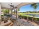 Inviting screened-in patio offering panoramic views of the lush golf course and water at 9415 Discovery Ter # 101A, Bradenton, FL 34212