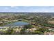 Stunning aerial view of residential area with beautiful lakes and lush green landscapes at 106 Kings Dr, Rotonda West, FL 33947