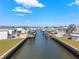 Waterfront view of a canal with docks and boat lifts between residences at 115 E Saint Lucia Loop, Apollo Beach, FL 33572