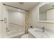Clean bathroom boasts white subway tiles in the shower/tub area and a modern vanity with a quartz countertop at 1153 Edgewater Cir, Bradenton, FL 34209