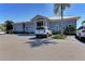 Exterior view of community building with ample parking at 1153 Edgewater Cir, Bradenton, FL 34209