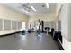 Community fitness center with modern exercise equipment and mirrored wall at 1153 Edgewater Cir, Bradenton, FL 34209