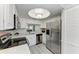Updated kitchen features stainless steel appliances and recessed lighting at 1153 Edgewater Cir, Bradenton, FL 34209