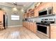 Open kitchen features stainless steel appliances and abundant counter space at 1153 Edgewater Cir, Bradenton, FL 34209