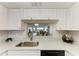 Kitchen sink overlooking living room area at 1153 Edgewater Cir, Bradenton, FL 34209