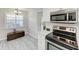 Bright kitchen features stainless steel appliances and modern countertops at 1153 Edgewater Cir, Bradenton, FL 34209