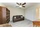 Living room with sofa, wood-look floors, and a ceiling fan at 1153 Edgewater Cir, Bradenton, FL 34209