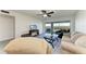Comfortable living room features slider doors to a balcony with a beautiful view at 1153 Edgewater Cir, Bradenton, FL 34209