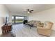 Cozy living room has neutral tones and a ceiling fan at 1153 Edgewater Cir, Bradenton, FL 34209
