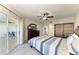 Bedroom featuring sliding glass doors to a balcony, furniture, and wood-look floors at 1153 Edgewater Cir, Bradenton, FL 34209