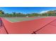 View of community tennis courts featuring multiple courts and nets on sunny day with blue sky at 1153 Edgewater Cir, Bradenton, FL 34209