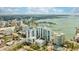 Gorgeous aerial view of a waterfront condominium, offering stunning views of the nearby harbor and more at 1155 N Gulfstream Ave # 1709, Sarasota, FL 34236