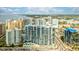 Beautiful aerial view of a blue and white condo in a waterfront city with bay views and lush landscaping at 1155 N Gulfstream Ave # 1709, Sarasota, FL 34236