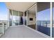Large balcony overlooking a marina, with sliding glass doors and an exterior view of the property at 1155 N Gulfstream Ave # 1709, Sarasota, FL 34236