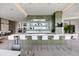 Modern bar area with sleek countertops, stylish stools, and decorative shelving at 1155 N Gulfstream Ave # 1709, Sarasota, FL 34236