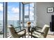 Cozy breakfast nook with water views through expansive windows at 1155 N Gulfstream Ave # 1709, Sarasota, FL 34236