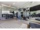 Modern gym is complete with weight machines, cardio equipment and mirrored walls for a comprehensive workout experience at 1155 N Gulfstream Ave # 1709, Sarasota, FL 34236
