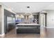 Modern kitchen featuring stainless steel appliances, a central island, and elegant design elements at 1155 N Gulfstream Ave # 1709, Sarasota, FL 34236