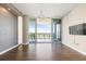 Bright living room with hardwood floors and views of a marina at 1155 N Gulfstream Ave # 1709, Sarasota, FL 34236