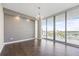 Bright living room with hardwood floors and views of a marina at 1155 N Gulfstream Ave # 1709, Sarasota, FL 34236