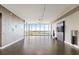 Expansive living room with sleek hardwood floors, floor to ceiling windows, and water views at 1155 N Gulfstream Ave # 1709, Sarasota, FL 34236
