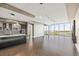 Open concept living space with kitchen, hardwood floors, and expansive windows with views at 1155 N Gulfstream Ave # 1709, Sarasota, FL 34236