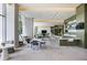 Spacious lounge area with modern furnishings, a bar, and plenty of natural light at 1155 N Gulfstream Ave # 1709, Sarasota, FL 34236