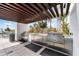 Outdoor kitchen with stainless steel appliances, granite countertops, and modern grill for outdoor cooking at 1155 N Gulfstream Ave # 1709, Sarasota, FL 34236