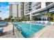 Resort-style pool deck with ample lounge seating and lush landscaping at 1155 N Gulfstream Ave # 1709, Sarasota, FL 34236