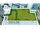 Luxury condo rooftop amenity featuring a putting green and parking spaces at 1155 N Gulfstream Ave # 1709, Sarasota, FL 34236
