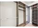 This walk-in closet boasts custom shelving and rods for optimal storage at 1155 N Gulfstream Ave # 1709, Sarasota, FL 34236