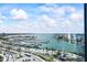 Expansive waterfront views from the condo's floor-to-ceiling windows showcasing the marina and cityscape at 1155 N Gulfstream Ave # 1709, Sarasota, FL 34236