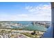 Stunning waterfront view of a marina with boats and cityscape, showcasing the building's prime location at 1155 N Gulfstream Ave # 1709, Sarasota, FL 34236