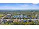 Beautiful aerial view of homes surrounding a serene pond in a well-maintained community at 11603 Gramercy Park Ave, Bradenton, FL 34211