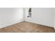 This is a bedroom with neutral carpet and a window with blinds at 11603 Gramercy Park Ave, Bradenton, FL 34211