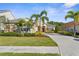 Inviting home featuring a well-maintained lawn, tidy landscaping, and a paved driveway at 11603 Gramercy Park Ave, Bradenton, FL 34211